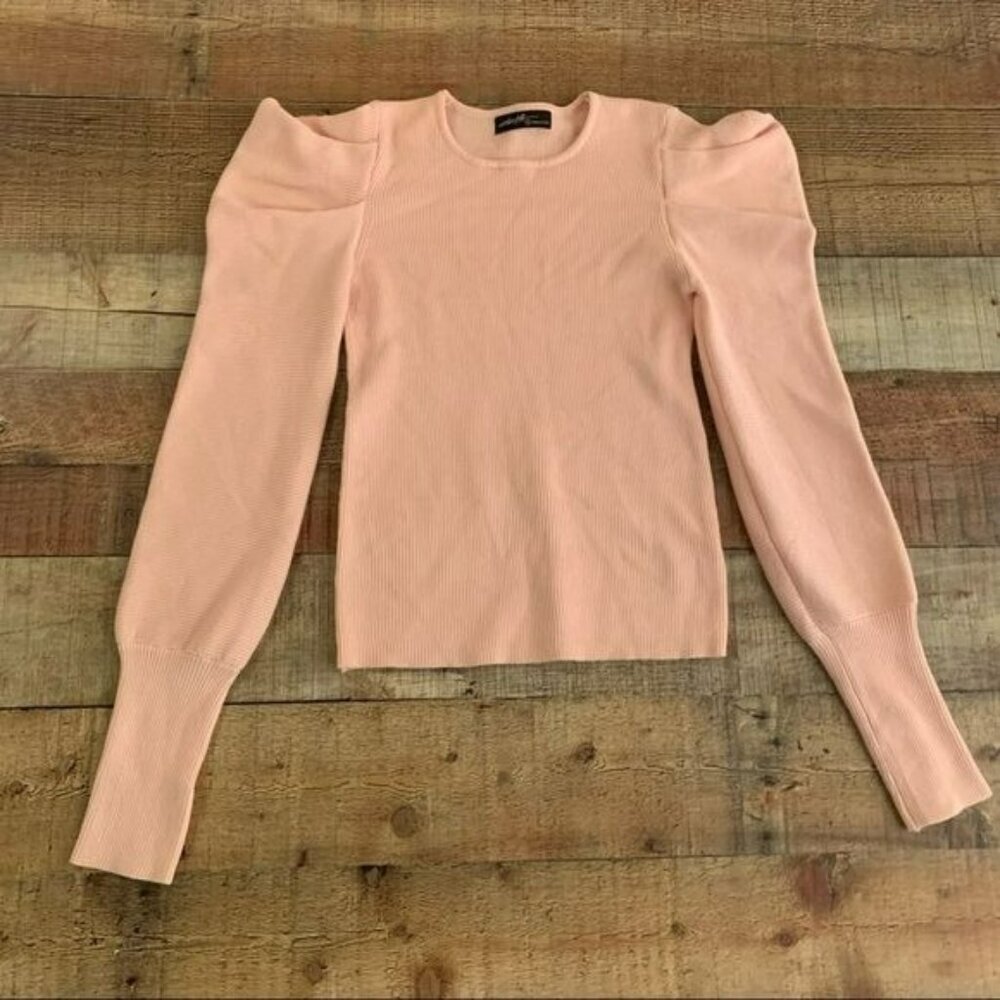 On twelfth women's size small pink ribbed knit sweater with puff long sleeves